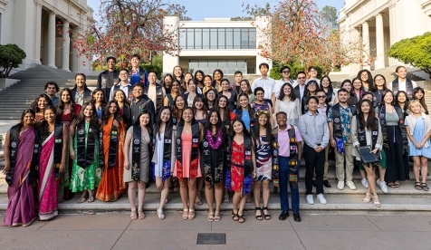 A group of API Graduates posing at their cultural graduation ceremony