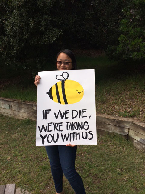 Student sign with a smiling bee saying 