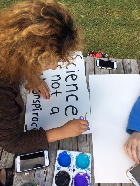 Students making signs