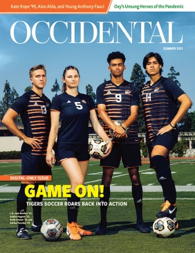 Four student athletes stand on a green field. Cover story: "