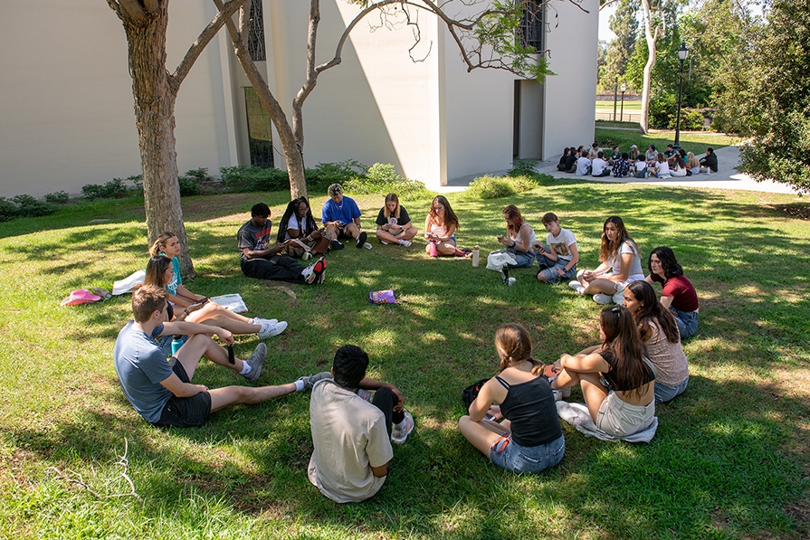 Students sit in circles during orientation at Occidental College