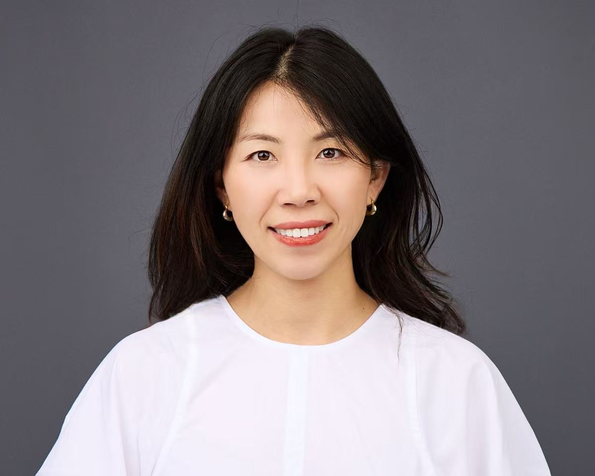 Woman in front of gray background