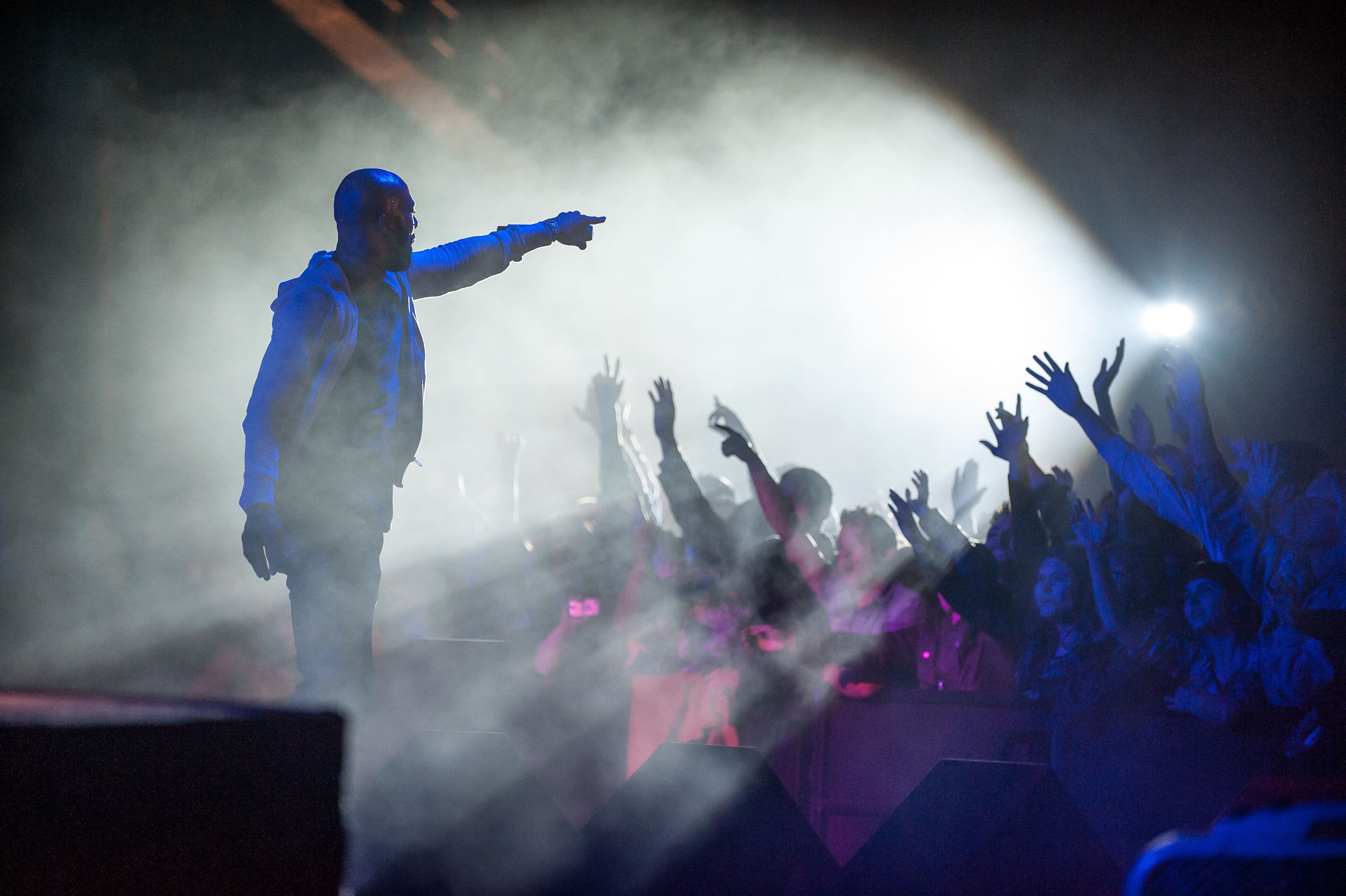 Picture of artist interacting with audience at concert