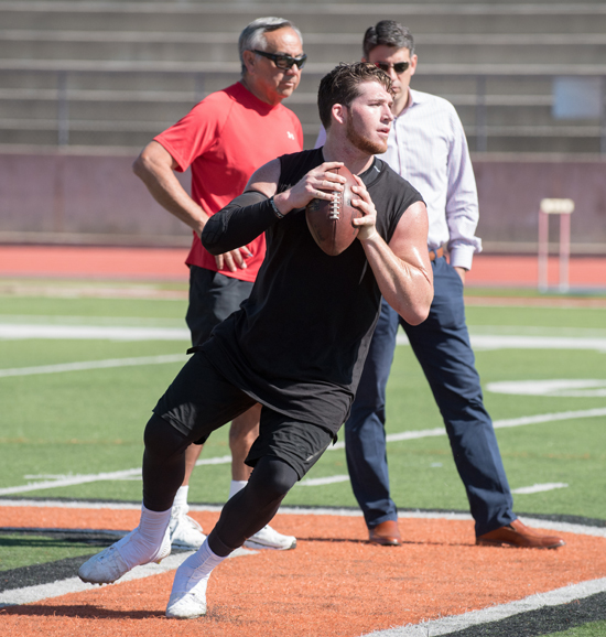 Prepping for pro day in February 2017 with Norm Chow, left, former offensive coordinator for USC, and son Carter, who was then Scott’s agent.