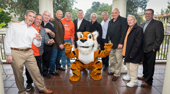 Larry Layne ’71, second from right, at a March 2018 event to support the Oxy football program.