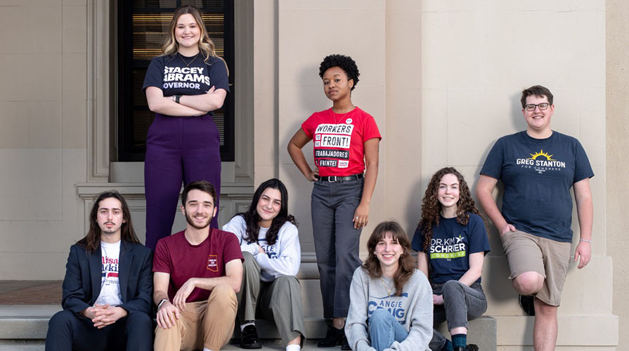 Oxy campaign semester students posing in front of a wall