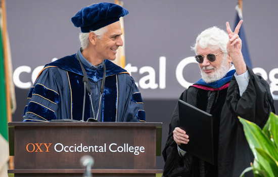 President Tom Stritikus and Professor Peter Dreier at Commencement in May 2025.