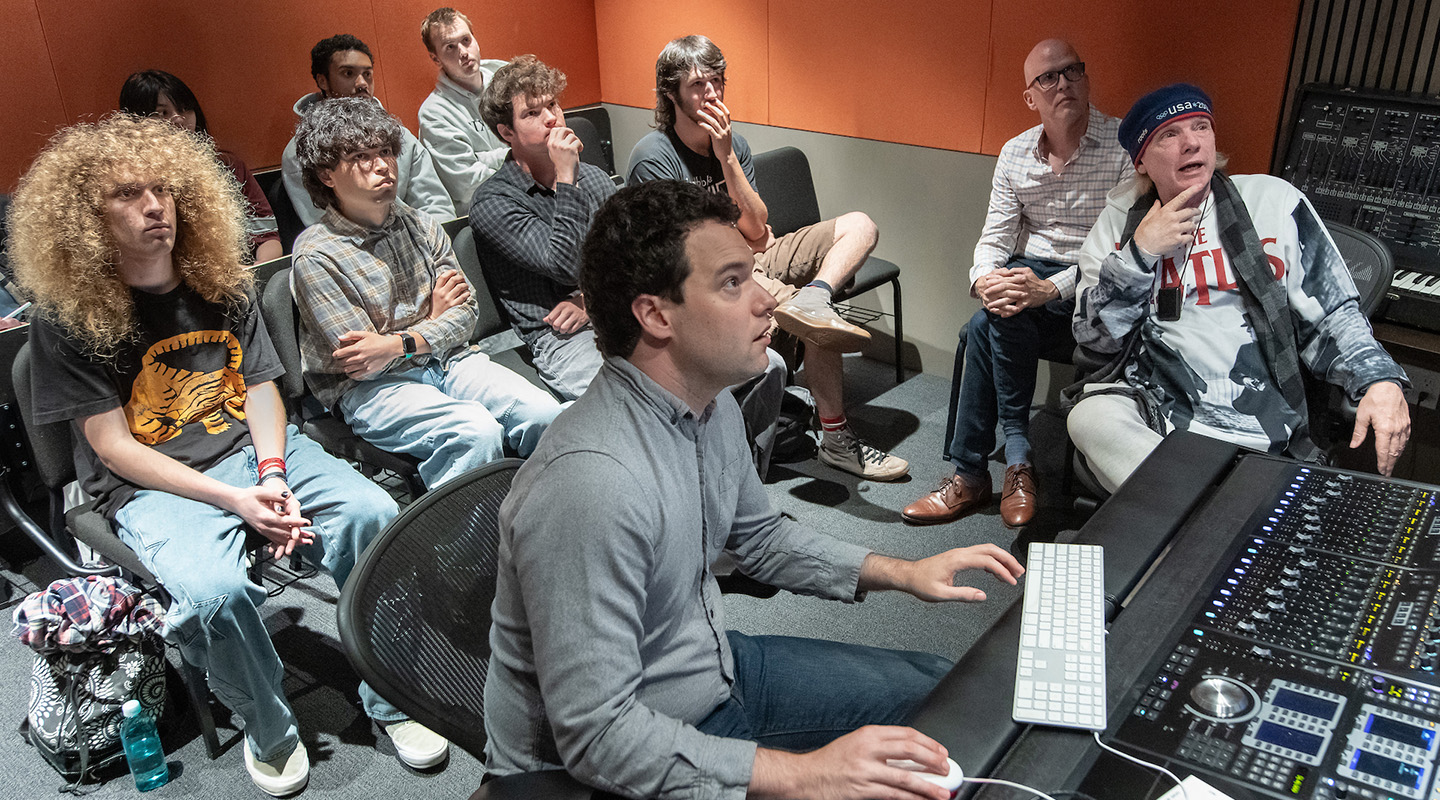 Curb Visiting Fellow Michael Lloyd, far right, and Resident Assistant Professor Max Foreman with Oxy students in the Choi Family Music Production Center.