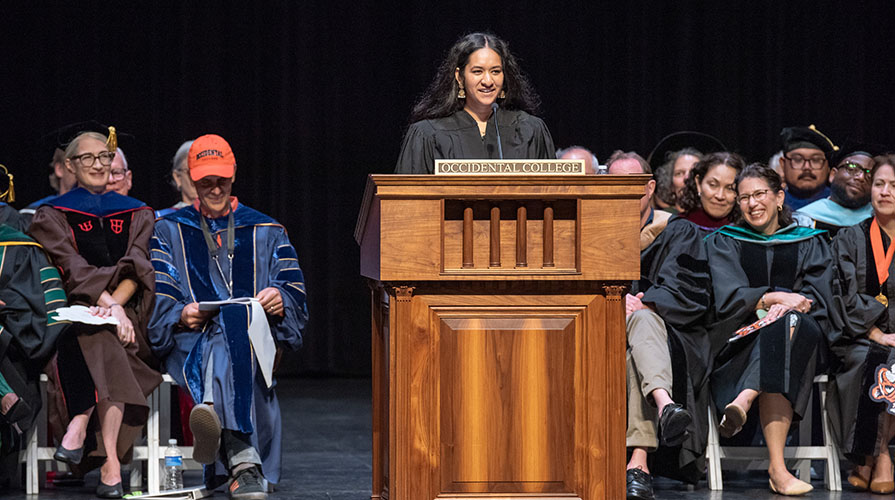 Occidental College student Trisha Bhima, ASOC president, delivers a speech at Convocation