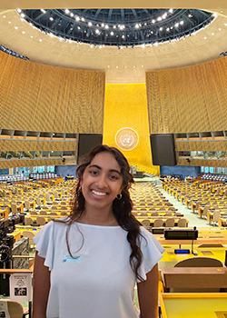 Aadya Nayak headshot inside the UN building main meeting room