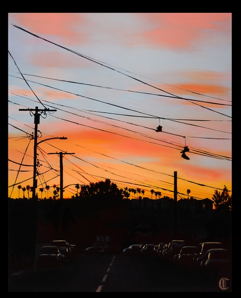 a view of los angeles and electrical poles at sunset