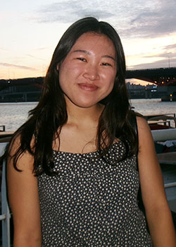 Anna Kim headshot on beach at sunset