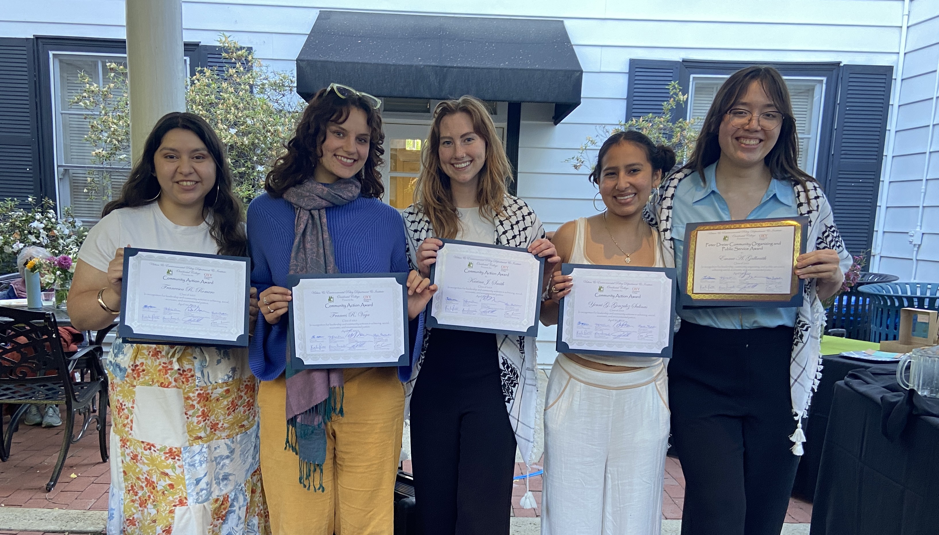 2025 Award Recipients (left to right), Student Community Action Award recipients are Francesca Romero, Frankie Vega, Karina Smith, and Yanni Gonzalez Salinas. The Peter Dreier Community Organizing and Public Service Award recipient is Emma Galbraith