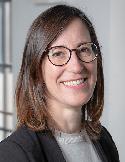 Manuela Borzone headshot with navy blazer