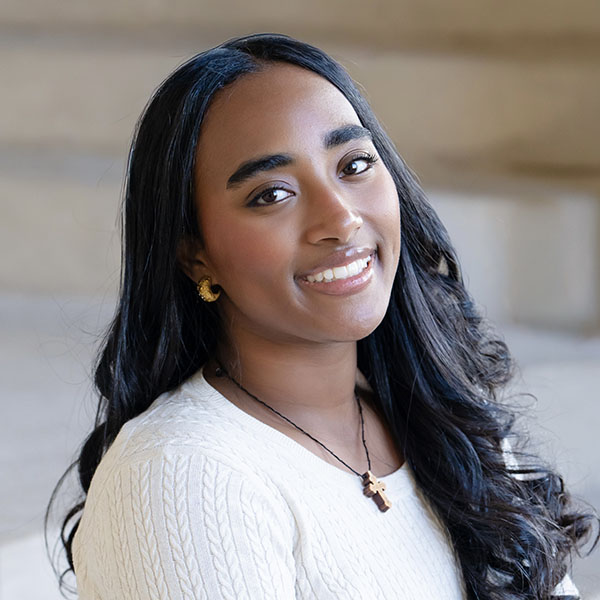 Brhane Gezahegne headshot with white top