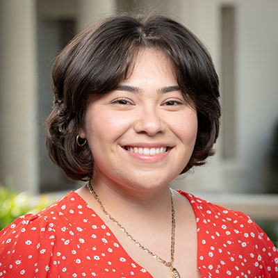 April Chagoya headshot with red top 