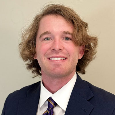 Christopher Butner headshot suit