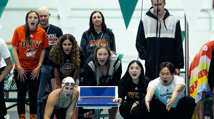Fans of the Occidental College swim team cheering on their athletes