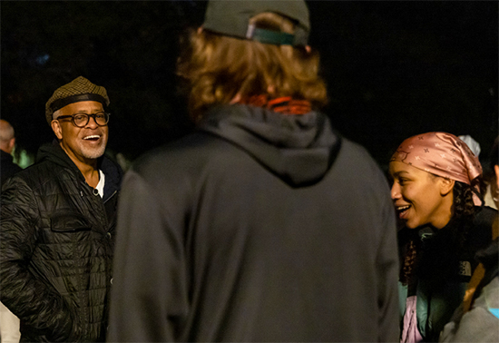 President Elam chats with students waiting in line for pancakes during Moonlight Breakfast on the Quad in 2022.