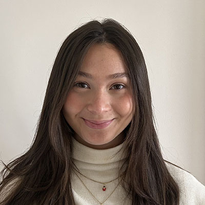Gabrielle Cohen headshot long brown hair