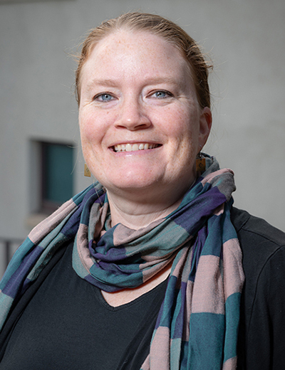 Margaret Gaida headshot with colorful scarf