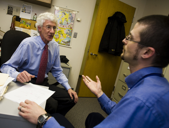 Dr. Roland Griffiths '68 with an associate