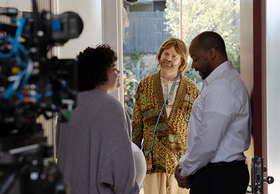 Actors Melanie Field, Rainn Wilson, and Donald Faison on the set of Home Delivery.