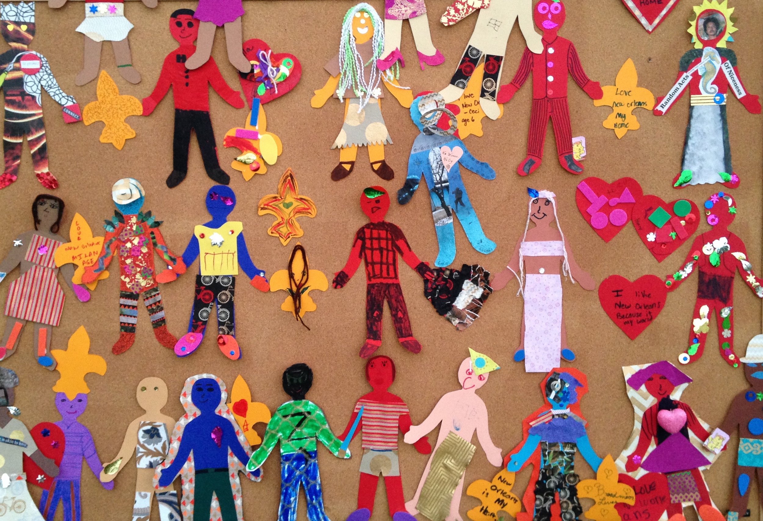 IMG_0698.jpg Colorful picture of children's artwork depicting different figures in brightly colored outfits.