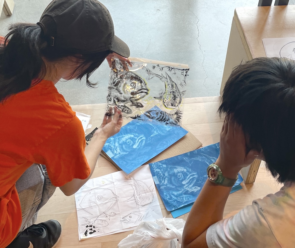 IMG_6754.jpeg color photo of two people making cyanotypes