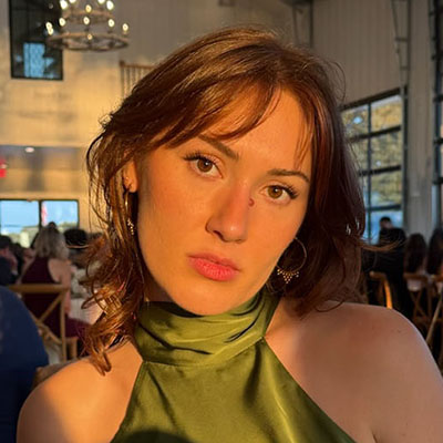 Kenna Mirzayan headshot green dress