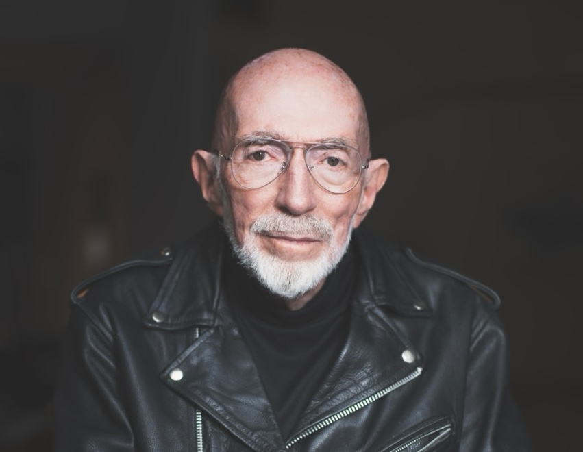 Kip Thorne by Christopher Michel copy.jpeg medium color portrait of Kip Thorne wearing a black leather motorcycle jacket and glasses, looking directly to camera