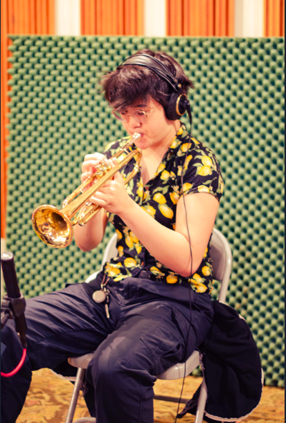 Lani Uyeda playing a trumpet