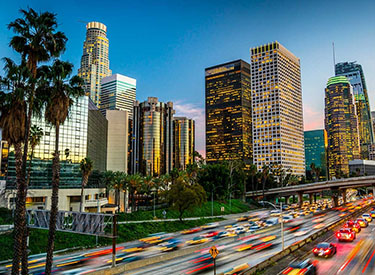 A colorful view of the Los Angeles downtown skyline near I-110