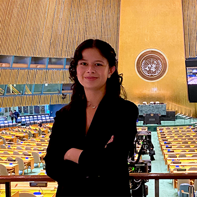 Mia Thiagarajan headshot inside the UN building in NYC