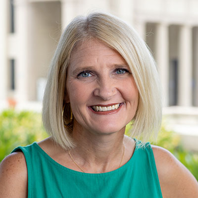 Milena Warns headshot teal top