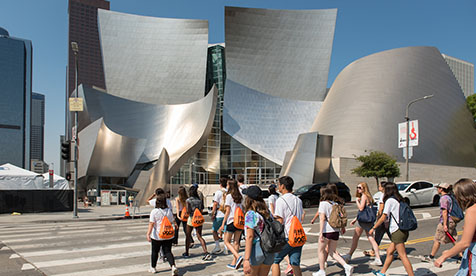 Group of Oxy students walking in front of the Walt Disney Concert Hall in downtown Los Angeles