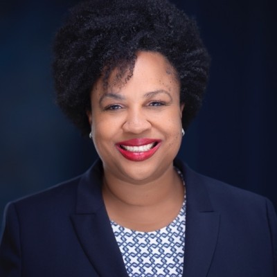 Namandje Bumpus headshot with navy blazer