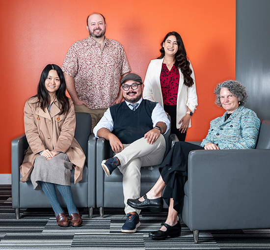 Seated, l-r: Associate professors Meiqing Zhang (computer science) and Frank Macabenta (biology), and professor Vanessa Yingling (kinesiology). Standing: Associate professors Eric Bjorklund (sociology) and Alyssa Rodriguez (biology).