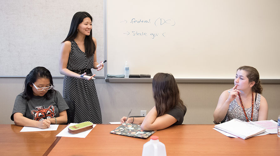 Professor Jane Hong teaches three students in a classroom
