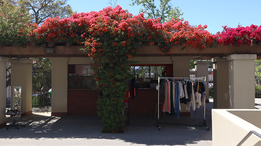The Concession Stand on the Occidental College campus, now Touchdown thirft store with a rack of clothing out front
