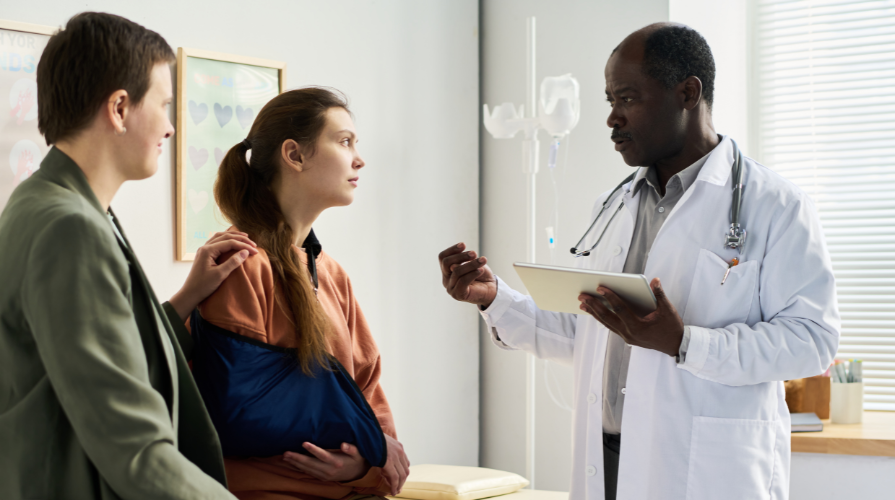 Photo including a doctor and two patients