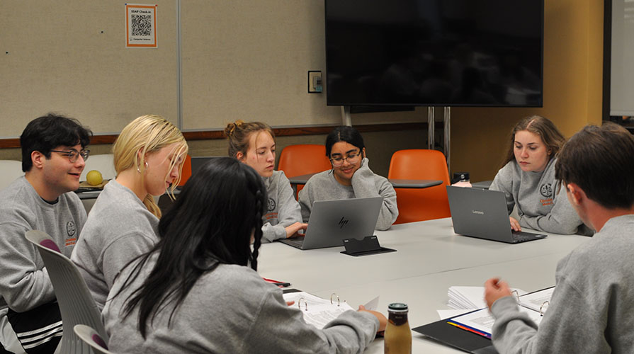 A group of Occidental College students debating as part of the Oxy Law Society