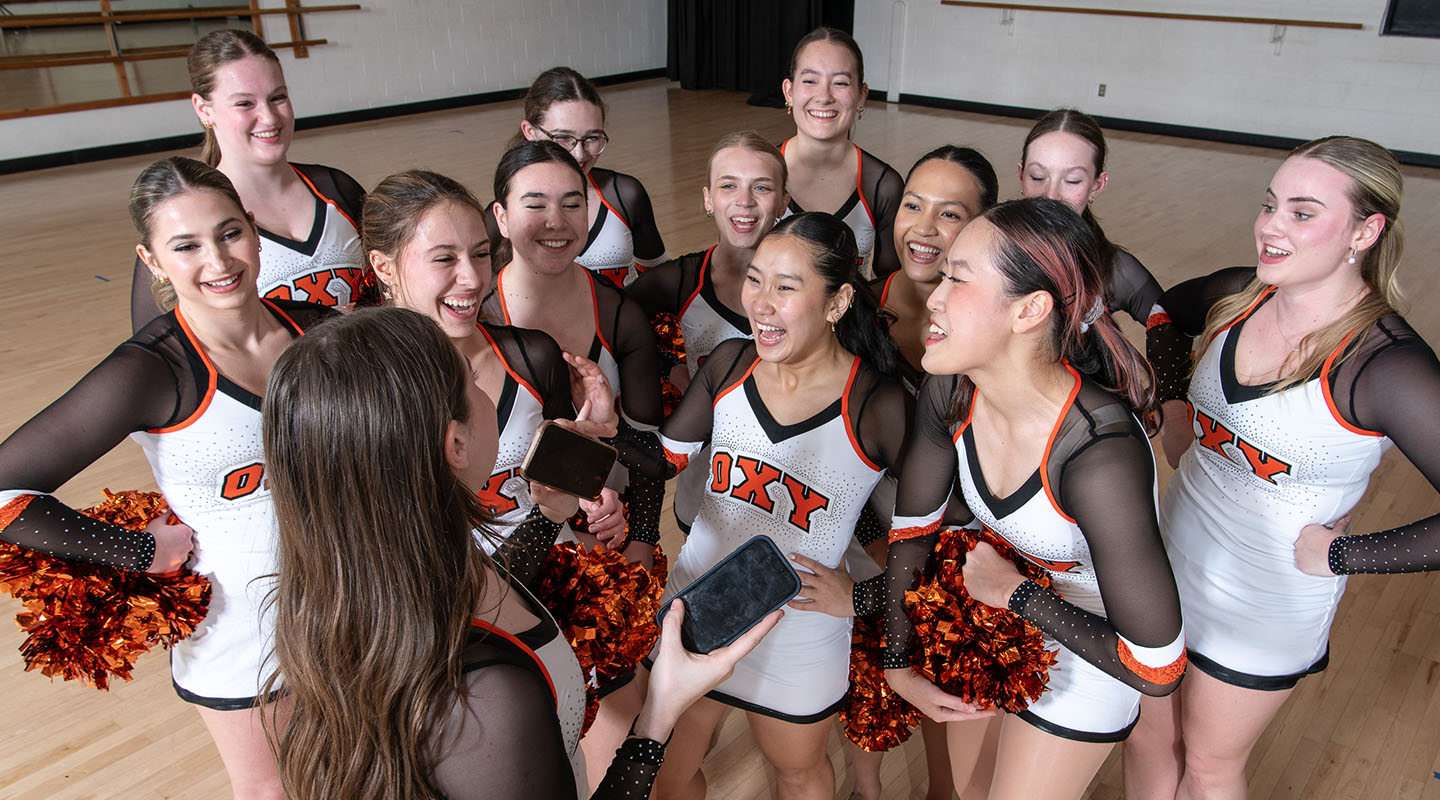 The Occidental College Dance team talking and laughing with each other happily and informally