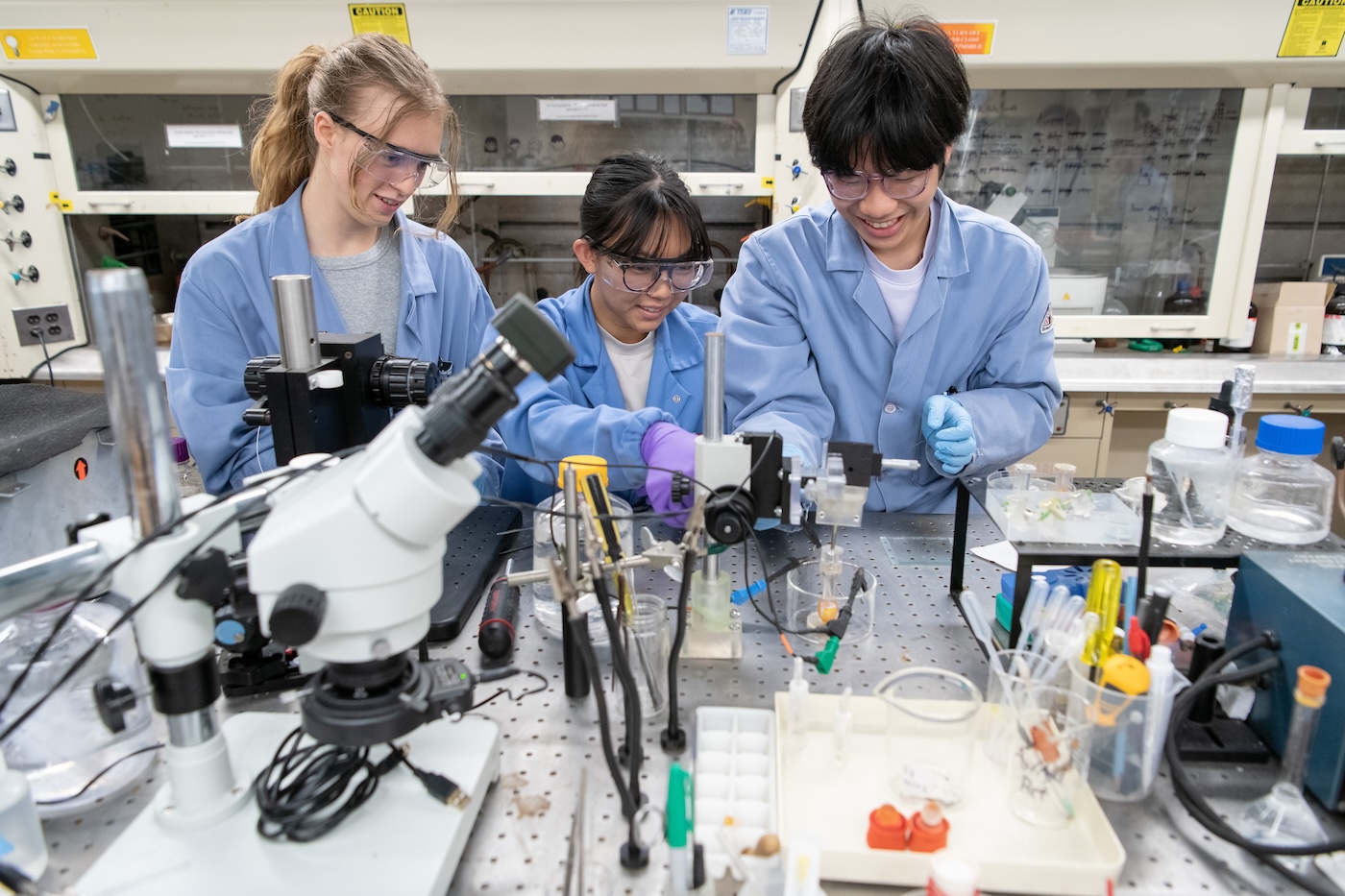 Skylar Cottell '28, Michelle (Mimi) Chen '26, and Damien Chow '28 in Fletcher Jones Professor of Chemistry Michael G. Hill's lab in the Norris Hall of Chemistry.