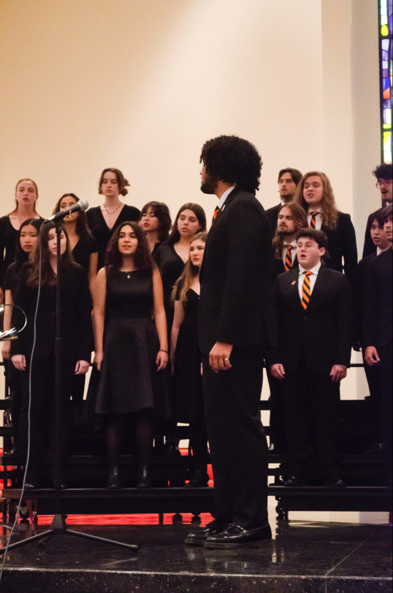 students singing in chapel