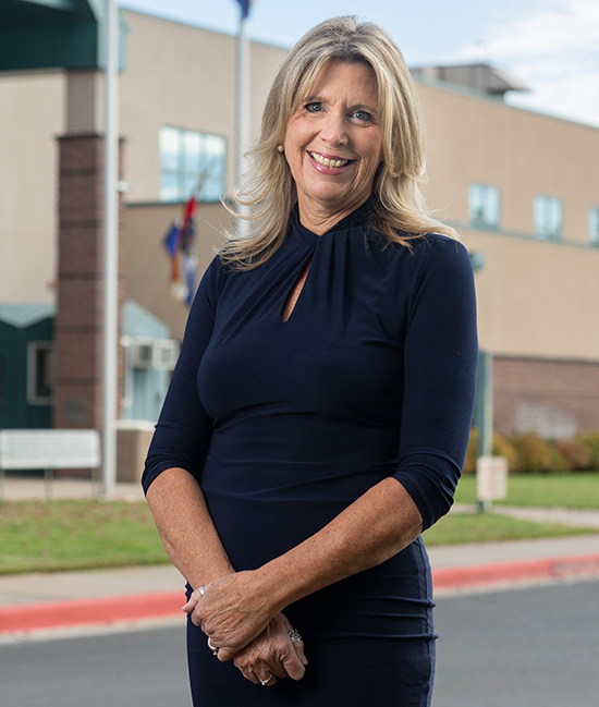 Jenny Dean Schmidt ’86, ChannelMom founder and executive director, outside Denver Correctional Facility. 