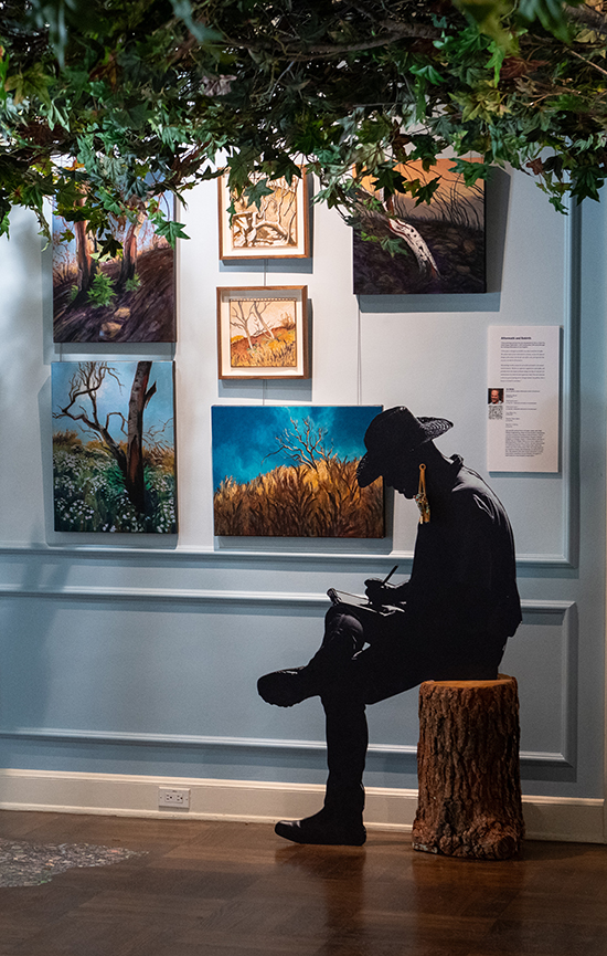 A silhouette of Joe Rohde '79 from the Living in a Wildlife Corridor exhibit.