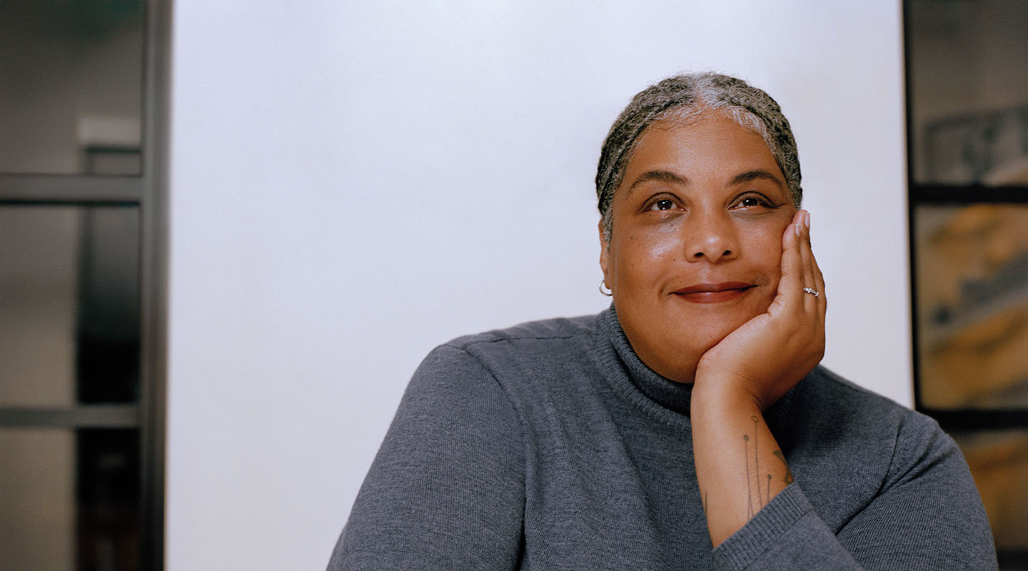 Bestselling author Roxane Gay headshot in grey sweater