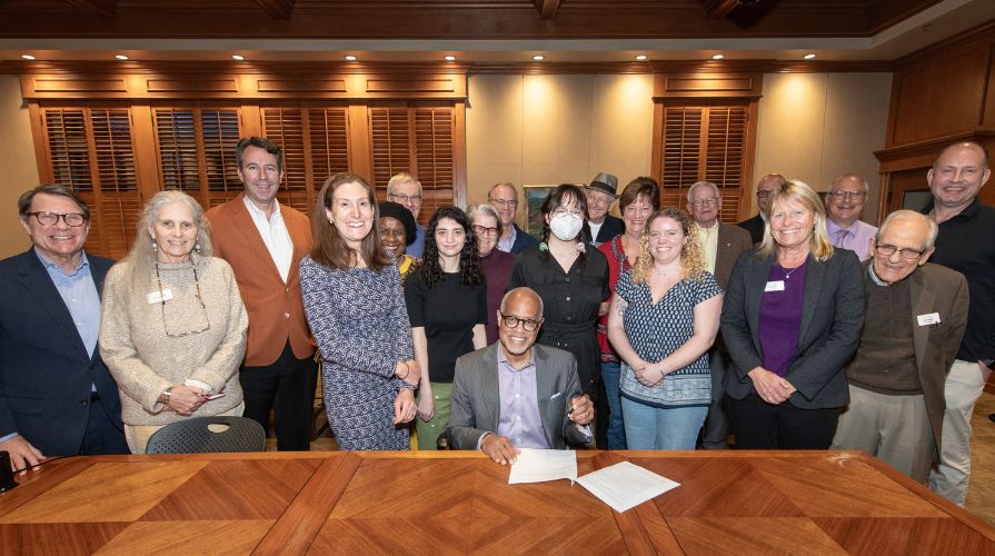 President Harry J. Elam, Jr. signs the Second Nature Climate Pledge