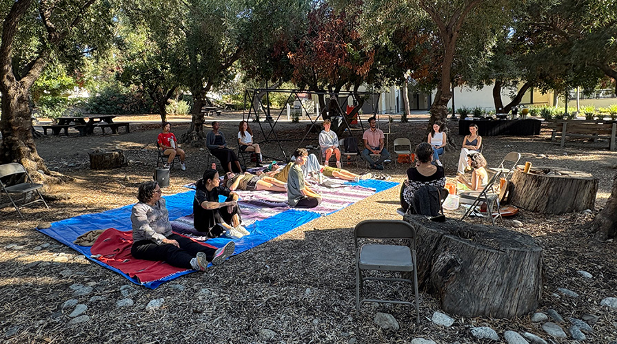 Students assembled for a sound bath in Oxy's Olive Grove on campus